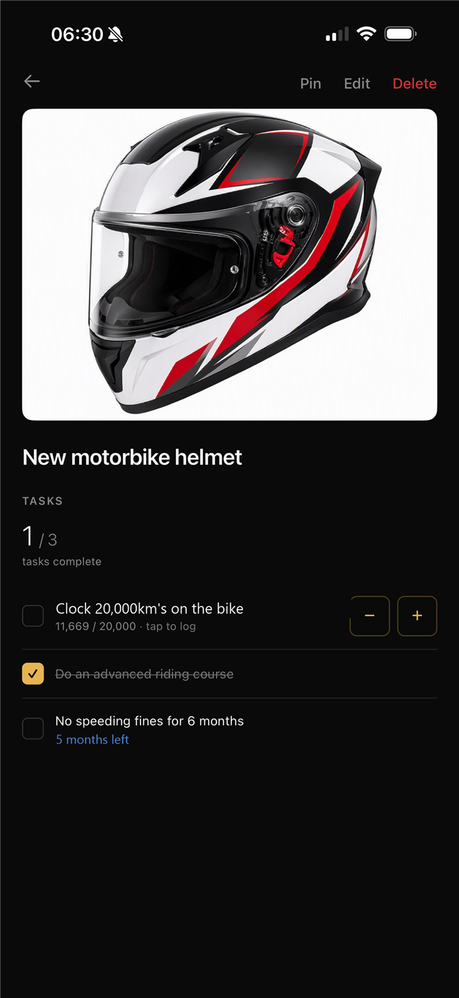Helmet reward mid-journey: 1 of 3 tasks complete, 11,669 of 20,000 km logged, five months of no speeding fines left